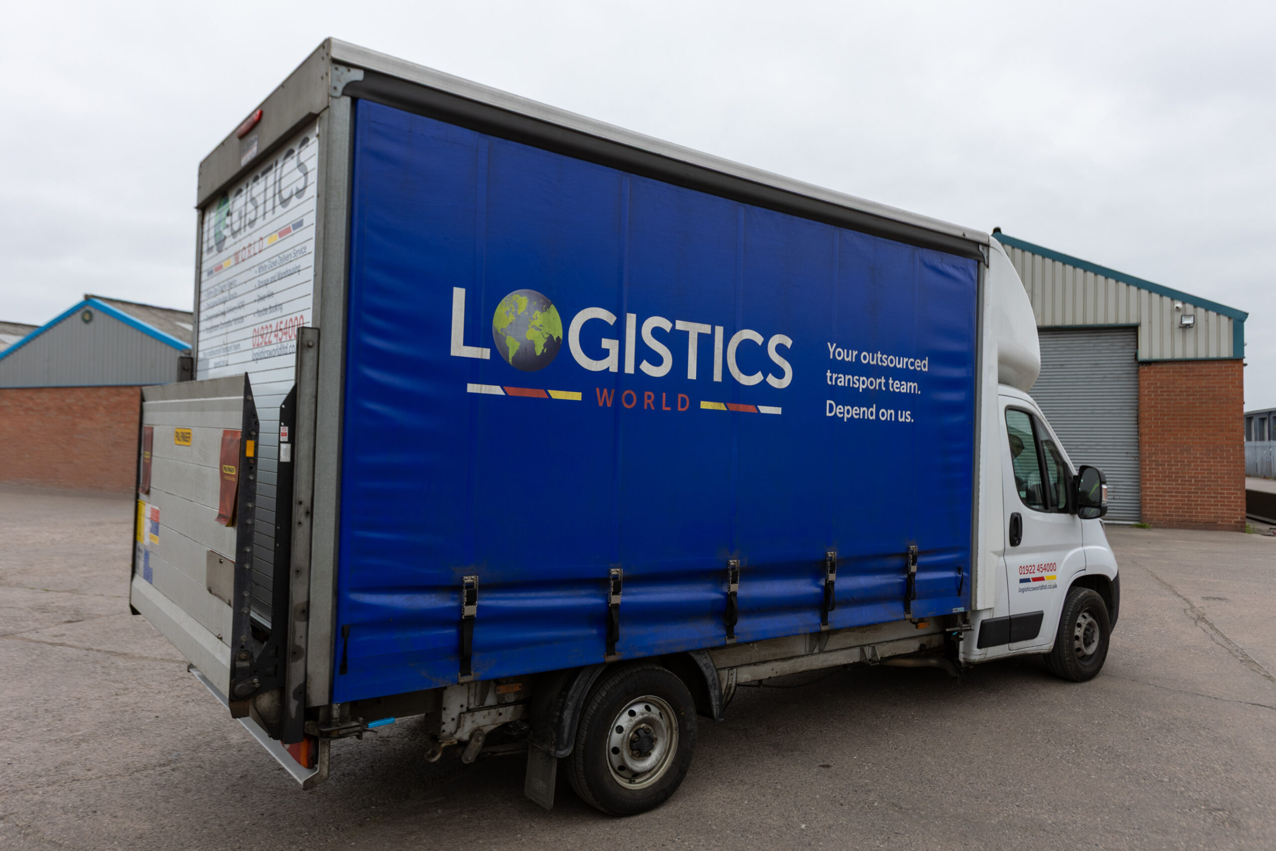Logistics World Truck with Tail Lift Logistics World Truck with Tail Lift